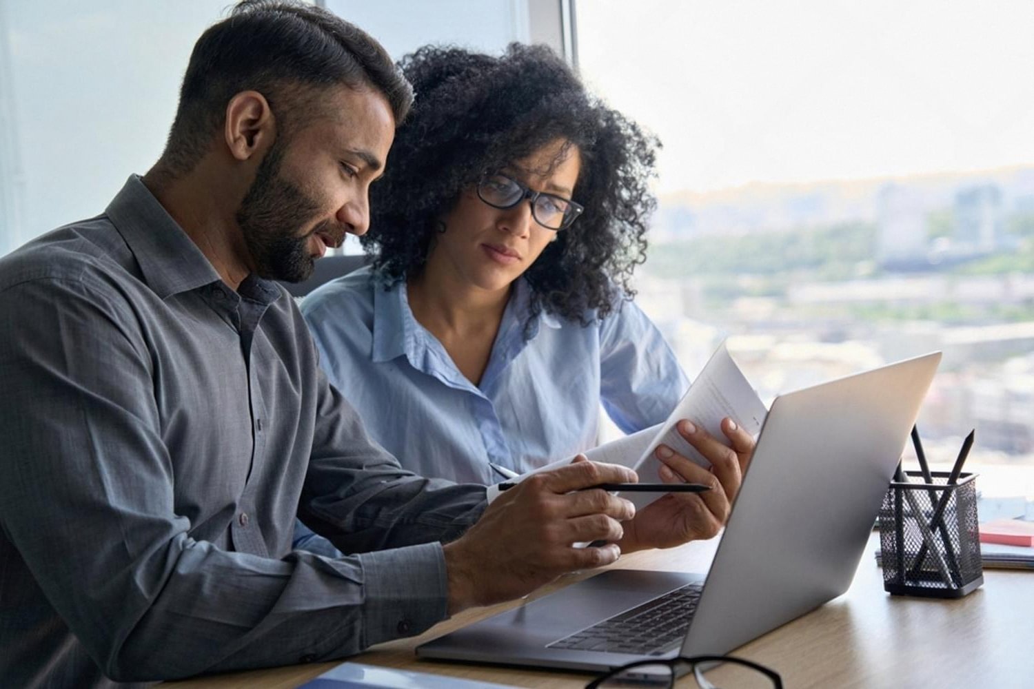 IT consultant and client reviewing DNS records during a domain transfer