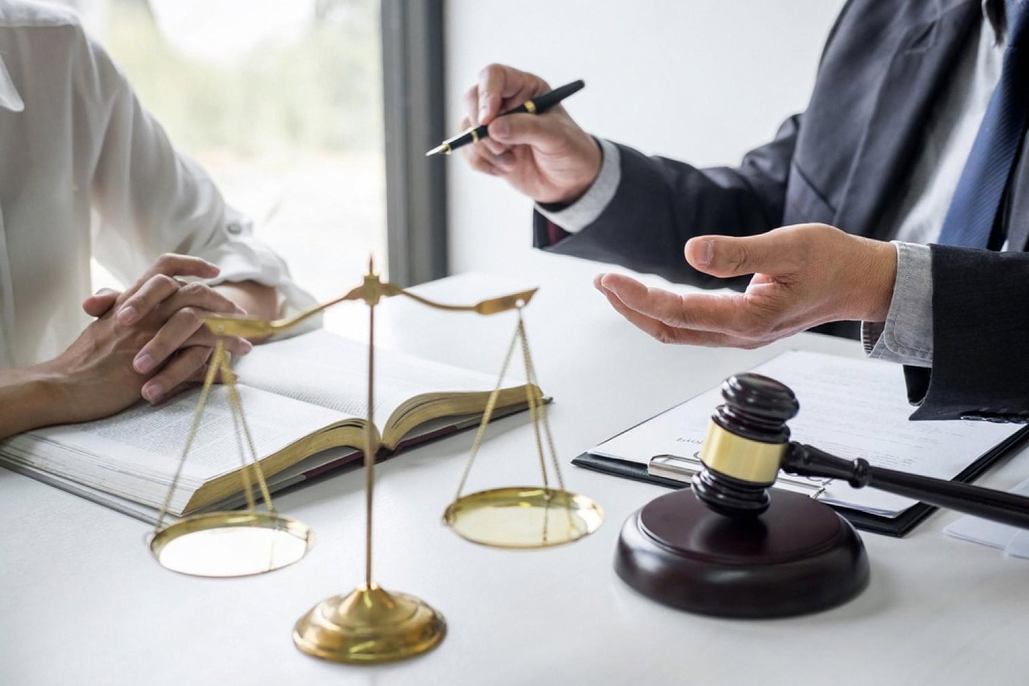Dubai lawyer explaining a case to a client during a consultation