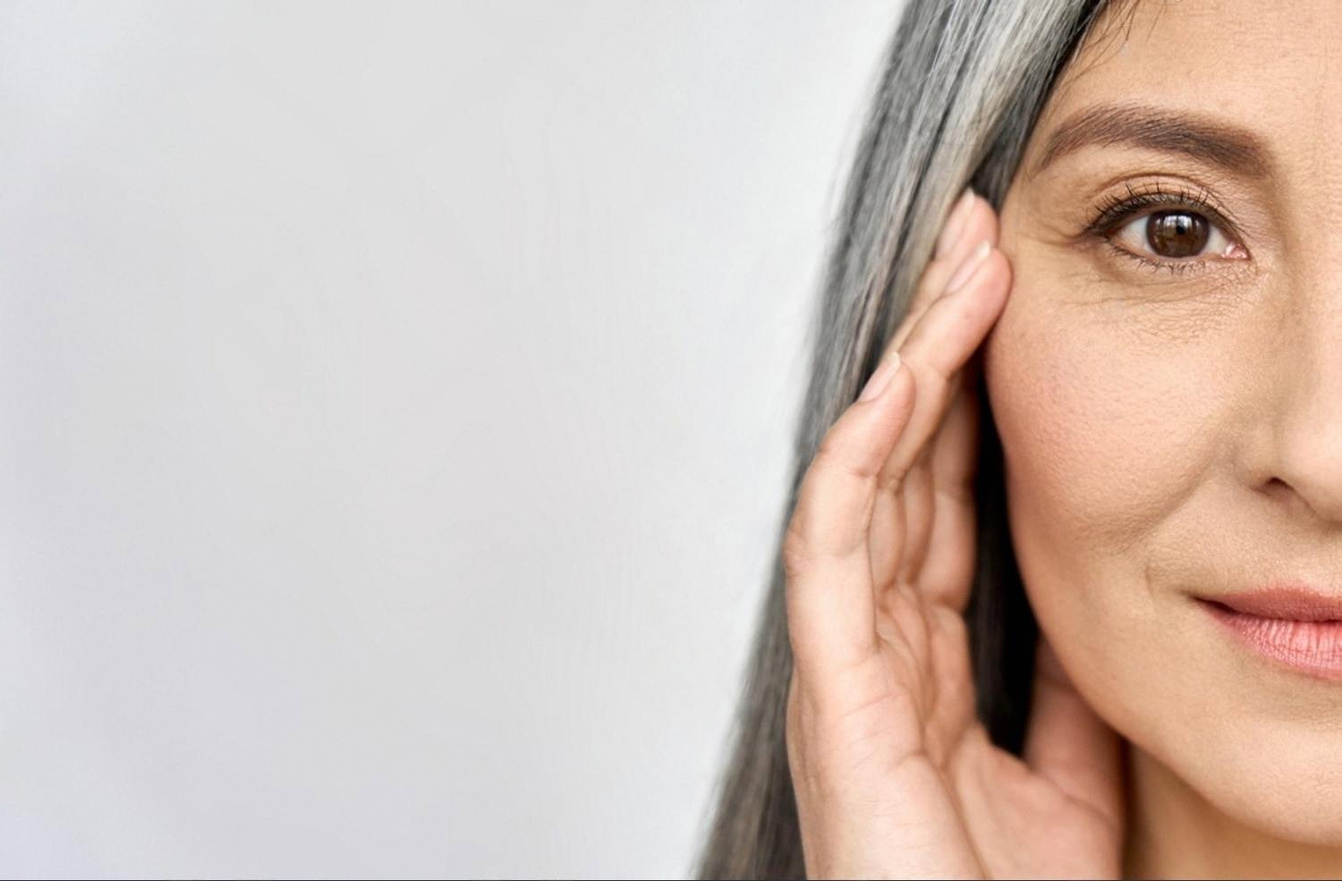 Mature woman with glowing skin after a facial rejuvenation treatment