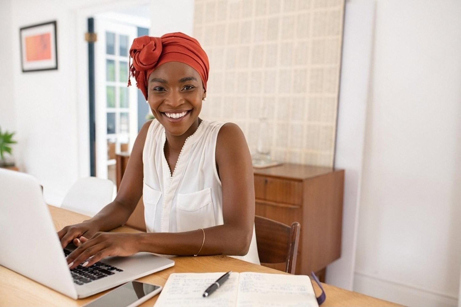 Business owner in the UAE preparing a domain transfer request on her laptop