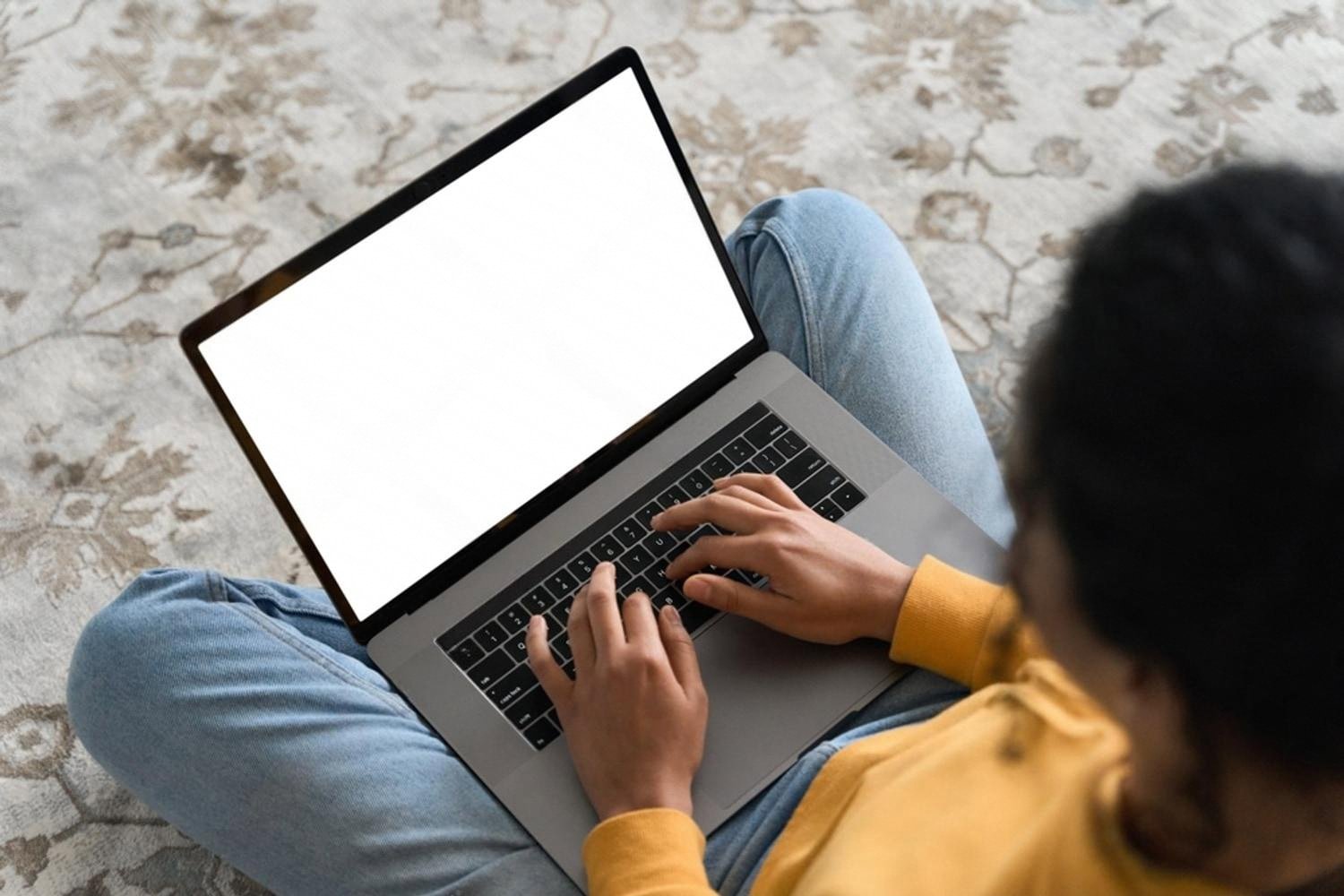 Person on a laptop researching how to advertise an event rental business online in the UAE